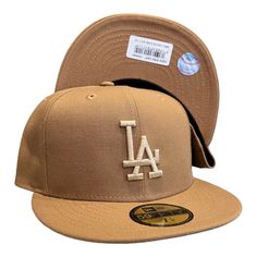 the los angeles dodgers'new era cap is shown in tan and gold, with a white