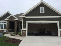 a large house with two car garages on the front