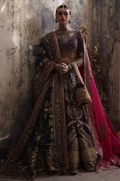 a woman in a bridal outfit posing for a photo