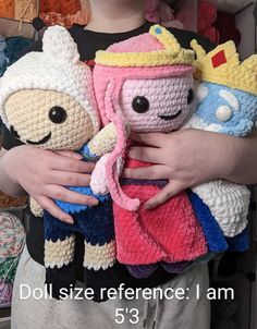 two crocheted characters holding each other in their arms with the caption doll size reference i am 5 - 3