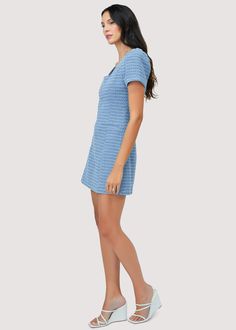 Get ready for summer in our chic Meridian Mini Dress! With a classic silhouette, this dress is perfect for transitioning from office to brunch. Made from a lightweight summer tweed, it features a square neckline, short sleeves, and a non-functional front pocket. Elevate your wardrobe with this versatile piece. WDWH13274 Imported Lined Self: 65% Cotton 20% Viscose 15% Polyester Model is 5 ft 9.5 inches; Bust: 32", Waist: 24", Hips: 34" and wearing a size Small Runs true to size Hand wash or wash Chic Blue Tweed Summer Dress, Blue Fitted Tweed Dress For Summer, Fitted Blue Tweed Summer Dress, Fitted Blue Tweed Dress For Summer, Casual V-neck Tweed Dress For Spring, Elegant Short Sleeve Tweed Dress For Summer, Casual Spring Tweed Dress V-neck, Spring Casual Mini Tweed Dress, Casual Spring Tweed Mini Dress