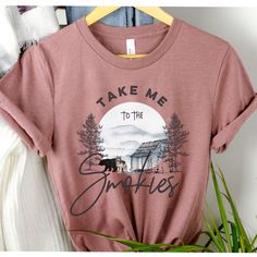 Take Me To The Smokies (Unisex Tee) Unisex Tee: S - XL Runs a little bit large. Order down for true to size, or order normally for a longer and more relaxed tee. This tee style is super popular because it drapes, has extra length, but still hugs your curves. ★ABOUT OUR UNISEX TEES★ Our unisex tees are super soft, long and lean. Customers consistently mention the tees run large, so order down for a tighter fit. The entire printing process is eco-friendly; inks are water based, bio-degradable and National Park Shirt Design, National Park T Shirt, Smooth As Tennessee Whiskey Shirt, National Park After Dark Shirt, Tennessee Shirt, Graphic Tee T-shirt With Crew Neck For Hiking, National Park Shirt, Mountain Tshirt, Mountain Shirt