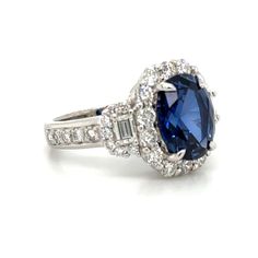 Indulge in luxury with our ladies statement 8.00carat oval cut lab grown blue sapphire & diamond ring. This stunning piece boasts a bold 8.00carat oval cut blue sapphire, perfectly accented with sparkling diamonds. Elevate any outfit and make a statement with this exquisite ring. Metal: 14K White GoldDiamond Weight : 40 Mix shape Diamonds 2.00ct twBlue Sapphire Weight: Lab created 6.00carat Width: 15mm - 20mm Sizable for desired ring size please leave us a note at the check out. Timeless Blue Oval Sapphire Ring, Timeless Oval Sapphire Jewelry, Elegant Oval Blue Sapphire Ring, Timeless Sapphire Jewelry With Oval Shape, Exquisite Oval Sapphire Ring With Diamond, Oval Sapphire Jewelry With Vvs Clarity, Exquisite Oval Blue Sapphire Ring, Exquisite Oval Sapphire Ring With Vvs Clarity, Exquisite Oval Sapphire Ring