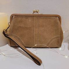 Coach Suede Clutch Wristlet - Size: ~5"X7" - Color: Brown Suede - Detail: Kiss Lock Clasp - Wrist Strap And Clasp - New With Linen Bag And Product Cards Included Wristlet Size, Suede Clutch, Bags Coach, Linen Bag, Brown Suede, Wrist Strap, Coach Bags, New Color, Bag Lady