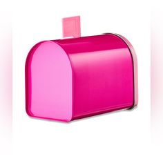 a bright pink mailbox on a white background