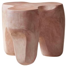 two wooden stools sitting next to each other