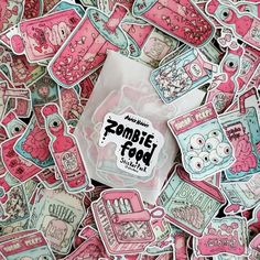 a pile of pink and white stickers on top of each other with the words zombie food