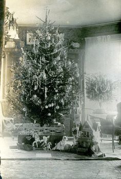 an old black and white photo of a christmas tree