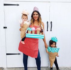 a woman and two children dressed up as cupcakes