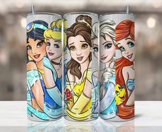 three disney princess tumblers sitting next to each other