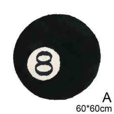 a black and white ball with the number eight in it's center, on a white background