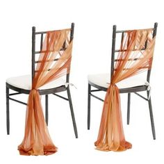 two chairs with orange sashes on them