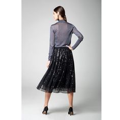 Our Fairy midi sequin skirt is sure to land you on the best-dressed list. Made from delicate embellished tulle, this midi skirt is saturated with pailletes and has a flared line. Tuck a statement tee or an elegant blouse into the flexible elasticated waistband for a bold fashion statement. Details: Fastens with a zip at the back, Elasticated waistband, Tulle underskirt, Fully lined. Composition: 100% Polyester Care: Dry clean Night Out Tulle Midi Skirt, Party Season Midi-length Skirt, Winter Party Midi Length Skirt, Sequined Flowy Party Skirt, Glamorous Midi-length Evening Skirt, Glamorous Midi Skirt For Evening, Winter Evening Sequined Skirt, Sequin Flared Party Skirt, Winter Evening Skirt With Sequins