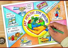 a person holding a pencil and drawing a healthy stay healthy poster on a wooden table