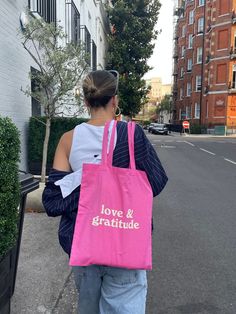 Love&Gratitude Tote Bag - handmade with love in London. It is reusable, can be easily carried, folded and stored. All these qualities qualify it to be replaced with the use of plastic and non-bio-degradable bags. You can wear a crochet tote bag as long as you wish and return on the environmental investment. A tote bag is your best option. You can carry it anywhere you wish to. If you need an all-rounder bag that can transform from a day bag to a travel bag with ease, tote bags are the best optio Trendy Everyday Recyclable Bags, Large Everyday Reusable Bags, Large Pink Everyday Bag, Large Everyday Reusable Bag, Daily Letter Print Rectangular Bag, Everyday Pink Pouch Canvas Bag, Eco-friendly Tote Bag For Everyday Use, Pink Bags With Letter Print For Everyday Use, Rectangular Bags With Letter Print