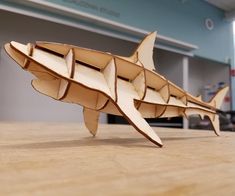 an origami model of a fish on a table