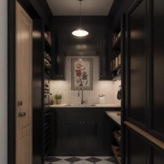 a kitchen with black cabinets and checkered flooring