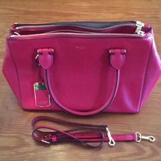 This Is A True Red Leather Ralph Lauren Handbag. The Lighting Makes It Look Fuchsia But It Is A True Red Like The Color Of The American Flag Stripes. It Is Very Gently Used And In Excellent Shape As You Can See In The Pictures. The Lining Is Immaculate And The Exterior Has No Flaws. It Has 3 Separate Compartments, 2 With Zipper Closures And The Center Closure Is A Double Magnet. There Are 4 Interior Pockets, One With A Zipper And One With A Snap. It Has Carry Handles As Well As An Adjustable Dro Classic Handheld Red Satchel, Classic Red Handheld Satchel, Ralph Lauren Elegant Shoulder Bag For Errands, Ralph Lauren Top Handle Formal Bag, Ralph Lauren Formal Top Handle Bag, Ralph Lauren Satchel Bag, Ralph Lauren Satchel Shoulder Bag For Shopping, Ralph Lauren Formal Shoulder Bag, Classic Ralph Lauren Shoulder Bag For Shopping