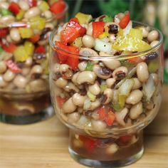 two glass bowls filled with beans and veggies