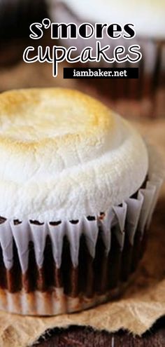 there is a cupcake with white frosting on it and the words s'mores cupcakes