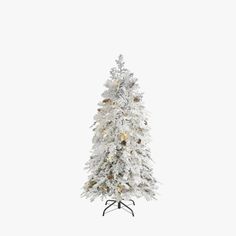 a white christmas tree with lights and snow on the top is standing in front of a white background