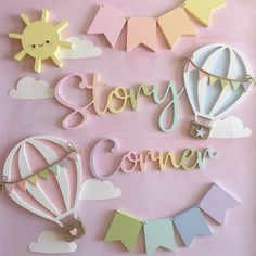 the words story corner are made out of cutout paper and pastel colors on a pink background