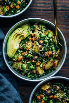 two bowls filled with vegetables and avocado