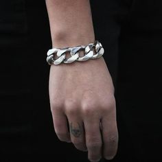 A handmade sterling silver 925 massive and heavy chain link bracelet.Each bracelet is cleaned and polished with care.The weight of the bracelet may vary according to size.Approx. weight: 97grChain link witdh: Approx. 18mmChain link thickness: Approx. 5.6mmThe bracelet is made of sterling silver 925 and is water resistant.All of our chain link products go through the same process. Full oxidization, cleaning and polishing/brushing. The oxidization (blackening) is left in the cracks and in between Modern Silver Cuban Link Bracelet With Chunky Chain, Sterling Silver Chunky Chain Bracelet, Silver Oval Link Chunky Chain Bracelet, Silver Bracelets With Chunky Oval Link Chain, Silver Link Bracelet With Chunky Chain, Silver Cuban Link Bracelet With Chunky Chain, Silver Chunky Chain Link Bracelet, Silver Chain Bracelet With Chunky Links, Modern Silver Chunky Chain Bracelet