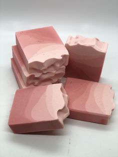 five pink soap bars stacked on top of each other