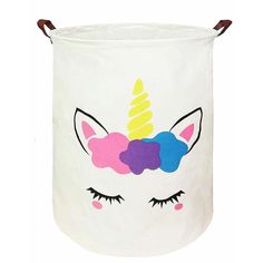 a white laundry basket with a unicorn face painted on it