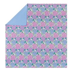 a pink and blue blanket with flowers on it