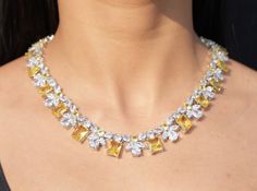 Yellow Diamond Necklace featuring semi precious canary yellow stones and cz diamond. Ideal jewelry to pair with your bridal wedding gown and prom gown. This Victorian Style LUXURY necklace will surely elevate your look. Perfect gift for Her. *𝐏𝐑𝐎𝐃𝐔𝐂𝐓 𝐃𝐄𝐓𝐀𝐈𝐋* * 𝐌𝐚𝐭𝐞𝐫𝐢𝐚𝐥: Brass * 𝐏𝐥𝐚𝐭𝐢𝐧𝐠: White Rhodium Plated * 𝐒𝐭𝐨𝐧𝐞: AAA-quality CZ Diamond & Canary. *𝐃𝐈𝐌𝐄𝐍𝐒𝐈𝐎𝐍𝐒* *𝐍𝐞𝐜𝐤𝐥𝐚𝐜𝐞* * 𝐖𝐞𝐢𝐠𝐡𝐭: 75 gm * 𝐋𝐞𝐧𝐠𝐭𝐡: 16.5 Inches * 𝐖𝐢𝐝𝐭𝐡: 0.6 Inches Etsy Jewelry Necklace, Yellow Diamond Jewelry, Canary Yellow Diamonds, Statement Necklace Wedding, Yellow Diamond Necklace, Crystal Wedding Necklace, Hollywood Jewelry, Bride Wedding Gift, Yellow Canary