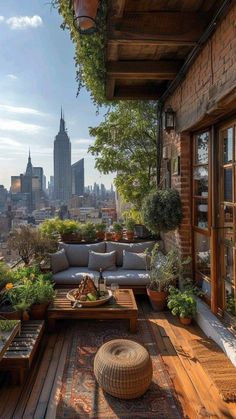 an outdoor living area with couches, tables and potted plants on the roof