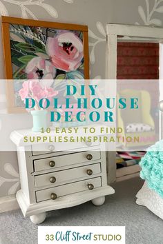 a white dresser sitting in front of a mirror with flowers on it and the words diy dollhouse decor 101 easy to find