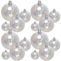 a bunch of white glass ornaments on a white background