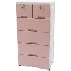 a pink dresser with four drawers on it