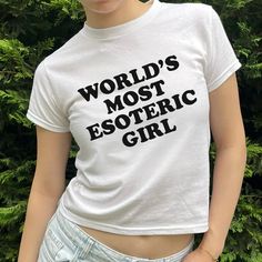 World's Most Esoteric Girl Baby Tee - printwithsky Unisex Trendy Tops With Funny Text, Casual Unisex Slogan Tops, Trendy Slogan Tops For Streetwear, Trendy Crew Neck Top With Custom Print, 90s Style Letter Print Tops, Spring Streetwear Tops With Funny Text, 90s Style Tops With Letter Print, Casual Slogan Gender-neutral Top, Funny Spring Tops With Letter Print