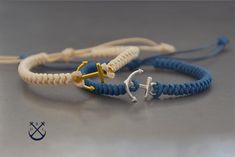 This is a listing for 2 braided bracelets with a gold tone anchor charm for her and a silver tone anchor charm for him and both  in the colour of your choice. These bracelets are made based on macrame techniques.- 100% handmade in France- the bracelet will wrap once around your wrist and makes for a nice subtle accessory bringing out the outdoor and adventurous person in you.- these bracelets make a great gift for any couple, the bracelets come in a fabric gift bag ready to be offered as a prese Handmade Adjustable Nautical Bracelets, Handmade Nautical Adjustable Bracelets, Nautical Anchor Bracelets As Gift, Nautical Anchor Bracelet As Gift, Nautical Anchor Bracelet Gift, Waxed Cord Bracelets, Macrame Techniques, Knot Bracelets, Snake Knot