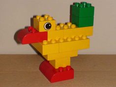 a lego bird is sitting on a table