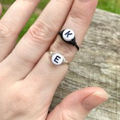 Wire Wrapped Plastic Letter Bead Ring - 1 RingThis ring features one small white plastic letter bead, wrapped in your choice of wire. The options are silver plated, copper, bronze, black, or gold colored wire. All except the silver plated have a non tarnish coating so they will never oxidize or change color. Being careful to not wear your rings while showering or washing your hands will make the silver rings last longer. Please keep in mind that these are made to order and may vary slightly, but Adjustable Initial Ring For Everyday, Adjustable Personalized Rings For Friendship, Personalized Adjustable Rings For Friendship, Adjustable White Initial Ring As A Gift, Adjustable White Initial Ring Perfect For Gifts, Adjustable White Rings For Everyday Wear, Minimalist Personalized White Initial Ring, Adjustable Initial Ring, Adjustable Hypoallergenic White Rings