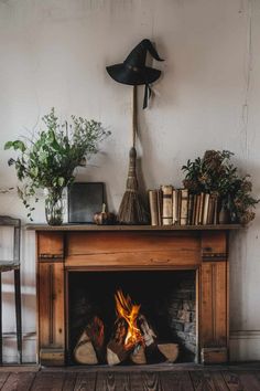 an old fireplace with a witch hat on top