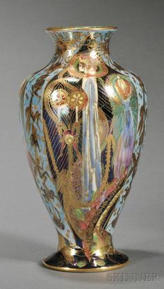 an ornate gold and blue vase is on display