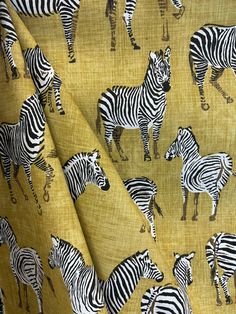 "The Africana Yellow drapery fabric is perfect for adding a touch of safari-inspired elegance to your space. With its vibrant yellow hue and subtle zebra pattern, this fabric brings a sense of adventure and charm to any room. Whether you're looking to make curtains, cushions, or other home decor items, while its friendly design creates a warm and inviting atmosphere. Get ready to infuse your home with the essence of the wild with Africana Yellow! FABRIC SAMPLES: *Actual colors may vary depending on individual monitor settings, please order a sample. Fabric Name for Sample Order: Africana Yellow Order your swatches here: https://www.etsy.com/listing/190677862/fabric-trim-samples FABRIC INFORMATION: - Content: Cotton Blend - Vertical Repeat: 25\" - Horizontal Repeat: 27\" - Width: 54\" - Cle Make Curtains, Pleated Drapery, Zebras Animal, Zebra Pattern, How To Make Curtains, Drapery Panels, Pillow Fabric, Friendly Design, Yellow Fabric