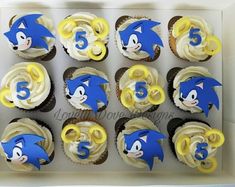 the cupcakes are decorated with blue and yellow frosting sonic the hedgehog characters