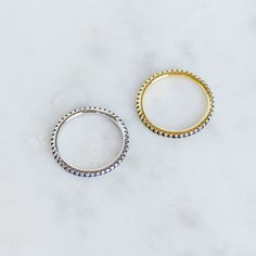 Sweet, simple, and dainty eternity band. Perfect for a minimalist look, or for stacking. ☆ Details ☆ * Made of 925 Sterling Silver * Available in 14k Gold Plating or Rhodium * We use a THICK, DURABLE plating - for a piece that will last you years to come! * VERY HIGH QUALITY * Available in sizes 4, 5, 6, 7, 8, 9, or 10 * Features stones throughout the entire ring * Measures 1.3mm in thickness * Made of Highest Grade Blue CZ stones for an authentic Sapphire Look * Also available in White CZ, Ruby Simple Stackable Midi Rings With Open Band, Simple Open Stackable Rings, Minimalist Adjustable Stackable Rings With Round Band, Minimalist Stackable Everyday Rings, Everyday Stackable Open Band Rings With Simple Design, Stackable Adjustable Eternity Band For Everyday, Stackable Dainty Midi Rings With Round Band, Dainty Stackable Midi Rings With Round Band, Gold Minimalist Stackable Eternity Band