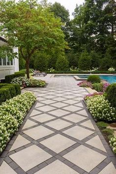 an outdoor garden with a pool and trees