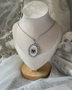 White Gothic Necklace Gift, White Gothic Metal Necklace, Handmade Gothic White Jewelry, Gothic Sterling Silver Necklace With Soldered Details, Silver Round Pendant Necklace For Halloween, Bohemian Silver Resin Jewelry, Gothic Silver Oval Necklace, Witchy Silver Jewelry Gift, White Gothic Aesthetic