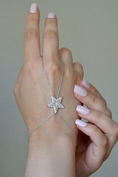 925 Sterling Silver Chain Star Necklace, Silver Colour Filled Finger Bracelet, Chain, Hand Chain Bracelet and Ring ❤️925 Sterling Silver Hand Chain ❤️ ❤️WE ARE HERE TO ADD MORE BEAUTY TO YOUR BEAUTY WITH OUR JEWELRY ❤️ ❤️ OUR DESIGNS ARE LIKE A LOVER AT YOUR SIDE ALL THE TIME ❤️ DOES NOT DARKEN ANTI - ALLERGENIC Excellent quality and reasonable price This jewelry is elegant, stylish and useful and Ideal Gifts for Christmas, Mother's Day, Valentine's Day, Graduation Gifts, Bridal Gifts Anniversar Sterling Silver Star-shaped Jewelry With Adjustable Chain, Sterling Silver Star Jewelry With Adjustable Chain, Elegant Silver Star Chain Bracelet, Elegant Silver Star-shaped Chain Bracelet, Silver Chain Bracelet For Party Fine Jewelry, Silver Chain Bracelet For Party In Fine Jewelry Style, Fine Jewelry Sterling Silver Star Necklace, Silver Star-shaped Bracelet With Adjustable Chain, Fine Jewelry Sterling Silver Star Shaped Necklace