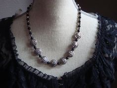 This gorgeous 18" necklace is made of black glass beads with silver metal embellishments.  How beautiful this would look with that basic black dress!! Black Metal Beaded Necklace With Silver Beads, Nickel Free Black Necklace For Party, Nickel-free Black Necklace For Party, Black Beaded Necklace With Silver Beads, Black Metal Necklace With Silver Beads, Black Necklace With Spacer Beads For Party, Black Metal Necklaces With Silver Beads, Silver Necklace With Spacer Beads For Party, Black Necklace With Silver Beads