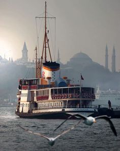 a large boat floating on top of a body of water